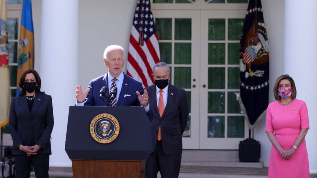 U.S. President Joe Biden (2nd L) speaks as (L-R) Vice President Kamala Harris, Senate Majority Leader Sen. Chuck Schumer (D-NY) and Speaker of the House Rep. Nancy Pelosi (D-CA) listen during an event on the American Rescue Plan in the Rose Garden of the White House on March 12, 2021 in Washington, DC. (Photo by Alex Wong/Getty Images)