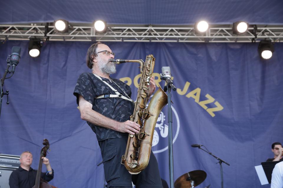 Scott Robinson performs on the baritone sax with the Mingus Big Band on Fort stage at the Newport Jazz Festival on Friday, July 29.