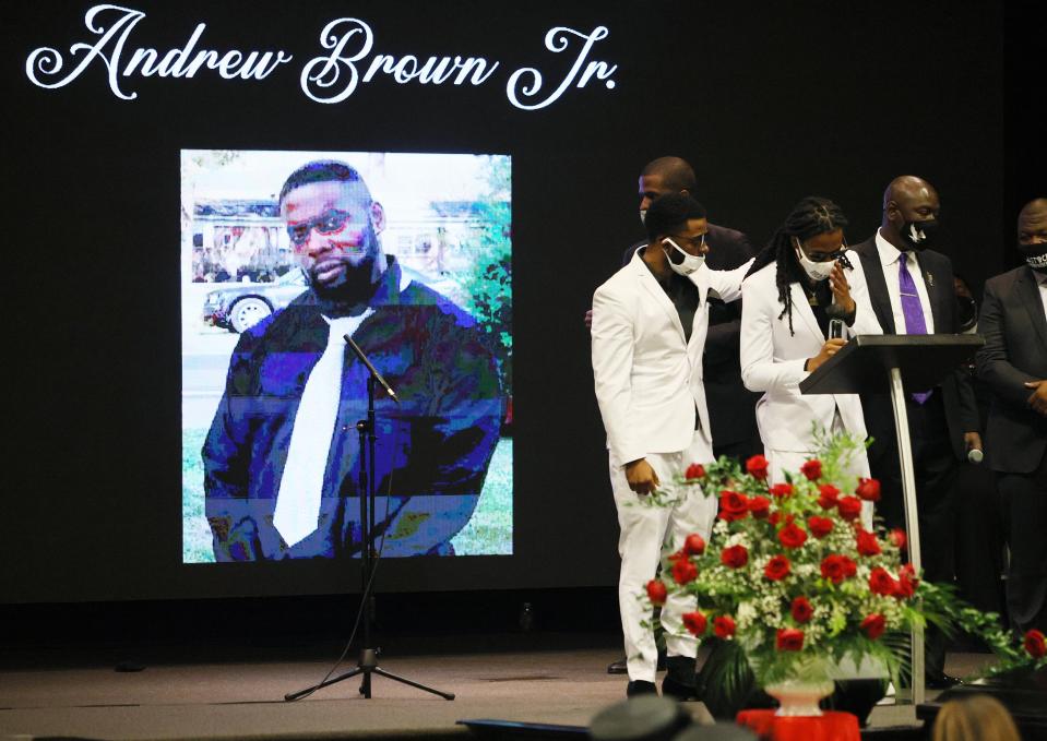 <p>ELIZABETH CITY, NORTH CAROLINA - MAY 03: Jha'rod Ferebee (L) and Khalil Ferebee speak during the funeral for their father Andrew Brown Jr. at the Fountain of Life church on May 03, 2021 in Elizabeth City, North Carolina. Mr. Brown was shot to death by Pasquotank County Sheriff's deputies on April 21.  </p> ((Photo by Joe Raedle/Getty Images))