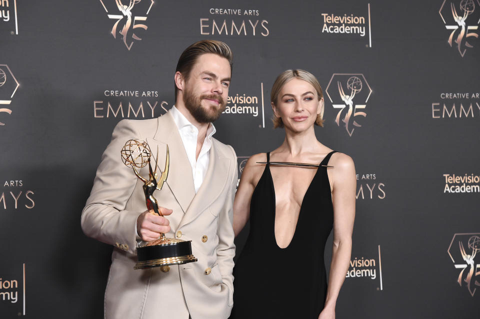 Derek Hough, left, poses with Julianne Hough in the press room after winning the award for outstanding choreography for variety or reality programming for "Dancing With The Stars" during night two of the Creative Arts Emmy Awards on Sunday Jan. 7, 2024, at the Peacock Theater in Los Angeles. (Photo by Richard Shotwell/Invision/AP)