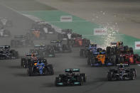 Mercedes driver Lewis Hamilton of Britain leads at the start of the Qatar Formula One Grand Prix. In Lusail, Qatar, Sunday, Nov. 21, 2021. (AP Photo/Darko Bandic)