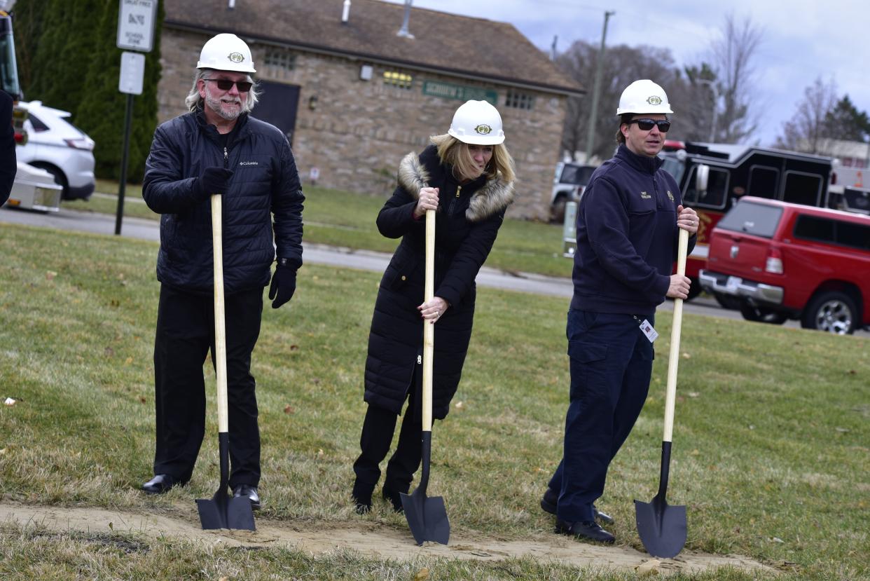 Former fire chief Dan Mainguy, Port Huron Mayor Pauline Repp, and Port Huron Fire Chief Corey Nicholson dig into the ground with shovels during the groundbreaking ceremony at the future site of the new Port Huron Fire Department Central Station at the 1400 block of 10th St., in Port Huron, on Thursday, Dec. 8, 2022.
