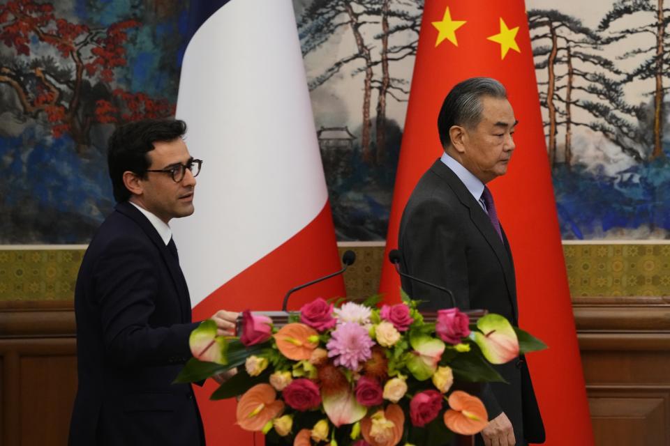 Chinese Foreign Minister Wang Yi, right, and French Foreign Minister Stephane Sejourne attend a joint press conference at the Diaoyutai State Guesthouse in Beijing, ChinaMonday, April 1, 2024. (Ken Ishii/Pool Photo via AP)