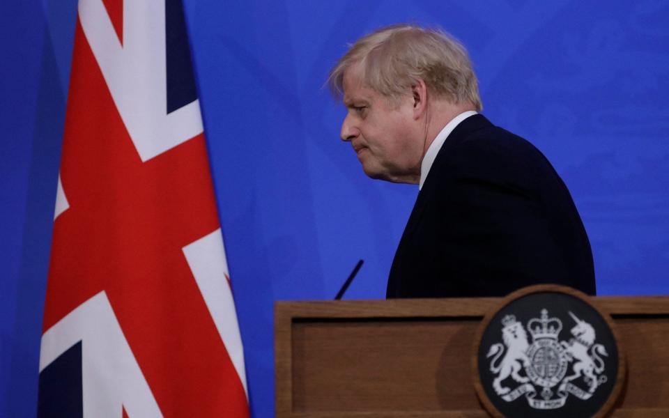  Boris Johnson leaves after giving an update on the coronavirus pandemic during a virtual press conference inside the new Downing Street Briefing Room in central London  - Matt Dunham/AFP