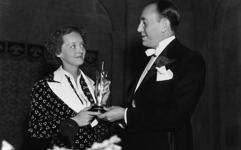 Bette Davis accepts her Academy Award in 1936 - Credit: Getty