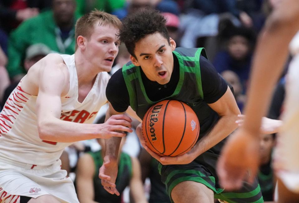 Cathedral Fighting Irish Sheldon Gatlin (31) rushes up the court Friday, Feb. 9, 2024, during the game at Fishers High School in Fishers. The Fishers Tigers defeated the Cathedral Fighting Irish, 56-51.