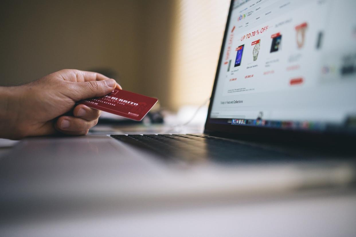  A person using a payment card on an ecommerce websites. 