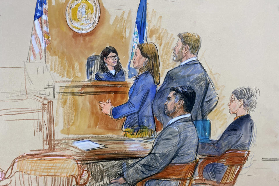 FILE - This courtroom sketch depicts Judge Dipti Pidikiti-Smith of the Fairfax County General District Court, presiding over the assault and battery trial of CIA officer trainee Ashkan Bayatpour, seated left, in Fairfax, Va., Wednesday, Aug. 23, 2023. Standing in front of the judge are the prosecutor, Deputy Commonwealth's Attorney Jenna Sands, left, and Bayatpour's defense lawyer Stuart A. Sears, right. The judge found Bayatpour guilty Wednesday of attacking a fellow CIA trainee with a scarf in the stairwell of CIA headquarters at Langley the previous year. Seated right is an unidentified defense team member. (Dana Verkouteren via AP, File)