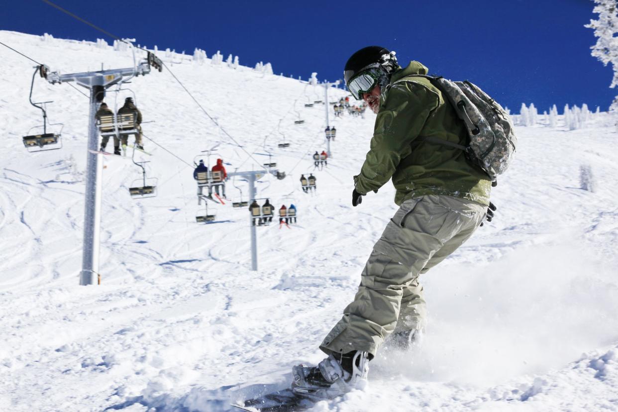 Snowboarder in action, Snowbird, Utah, USA