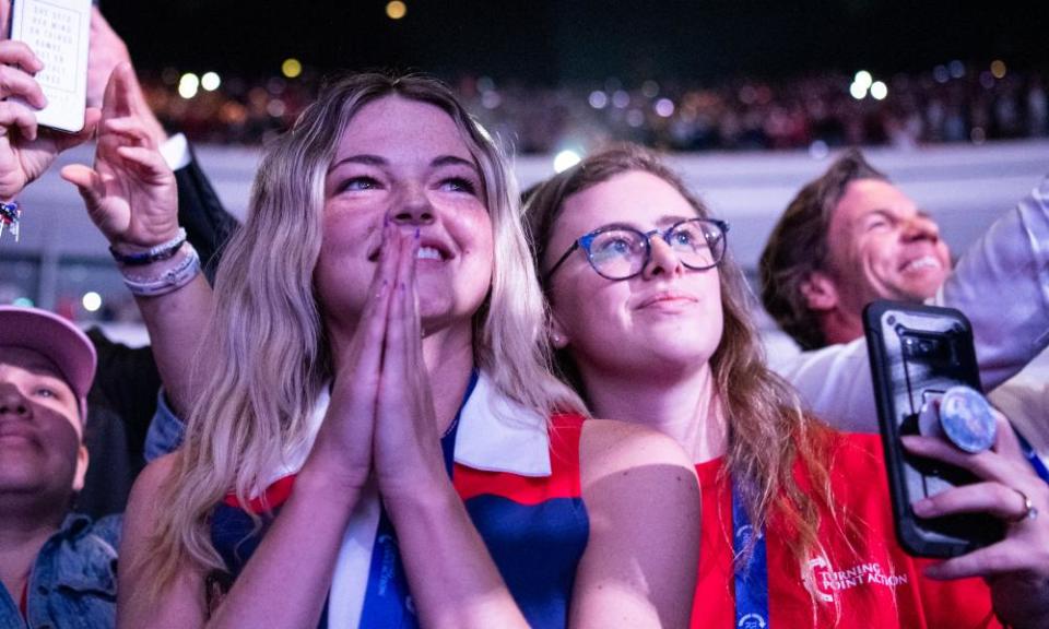 Admirers look on as Donald Trump takes the stage at a “rally to protect our elections” in July 2021 hosted by Turning Point in Phoenix, Arizona.