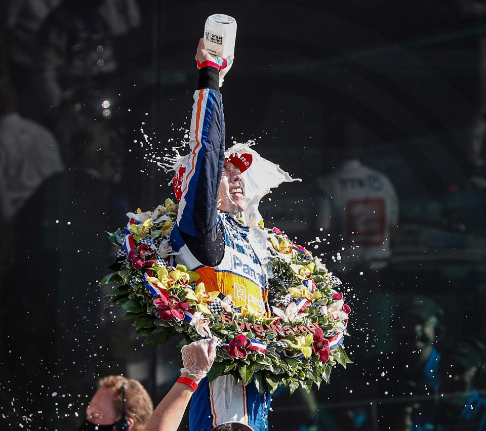 Rahal Letterman Lanigan Racing driver Takuma Sato (30) of Japan pours milk on his face after winning the 104th running of the Indianapolis 500 at Indianapolis Motor Speedway on Sunday, August 23, 2020. 