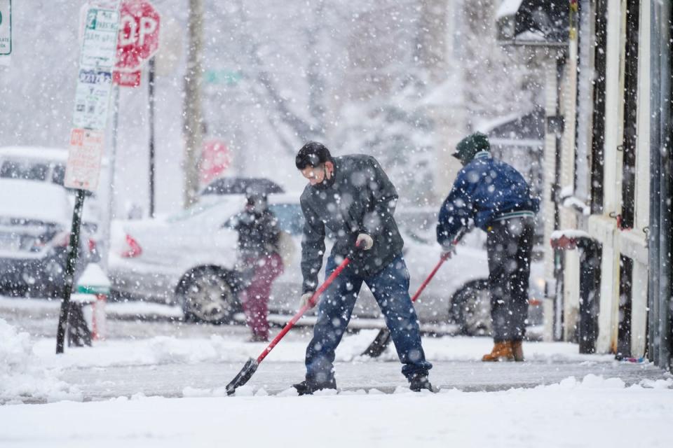Clearing a sidewalk in Philadelphia (AP)