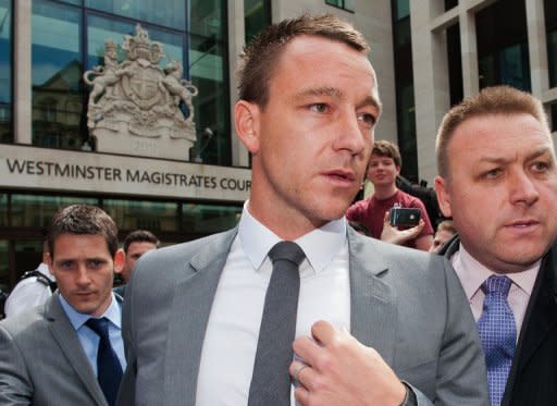 Former England captain John Terry (C) leaves Westminster Magistrates court in London on July 13. Terry received a rousing reception at his first match since his acquittal on racism charges as European champions Chelsea played to a 1-1 draw with Paris Saint-Germain