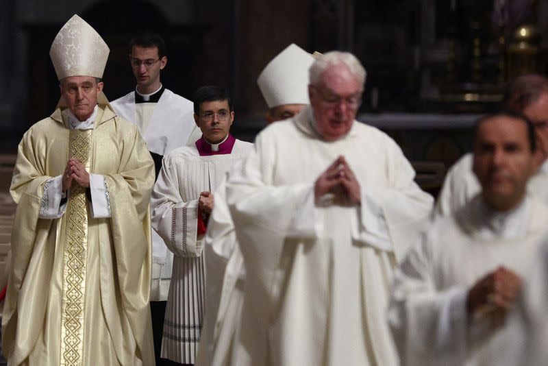 Benedict's top aide leads mass in memory of Pope Emeritus