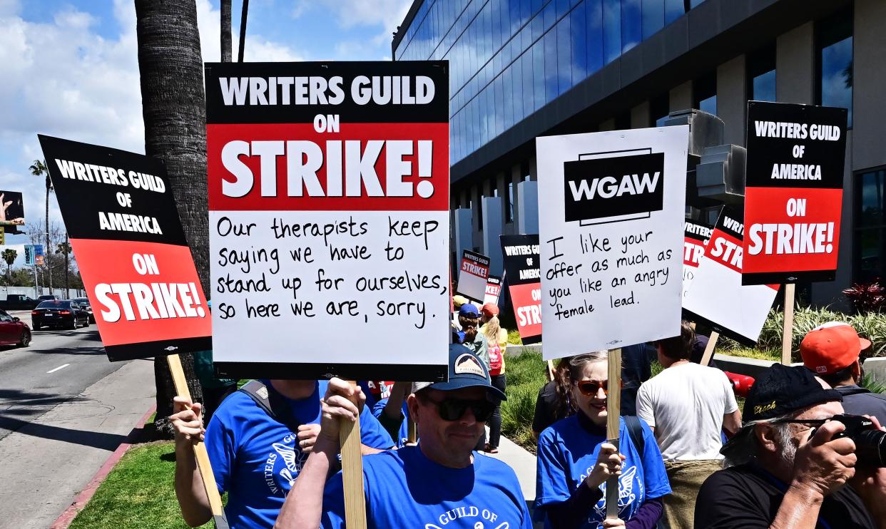 Writers picket in front of Netflix on Sunset Boulevard in Hollywood, California, on May 2, 2023, as the Writers Guild of America (WGA) goes on strike.