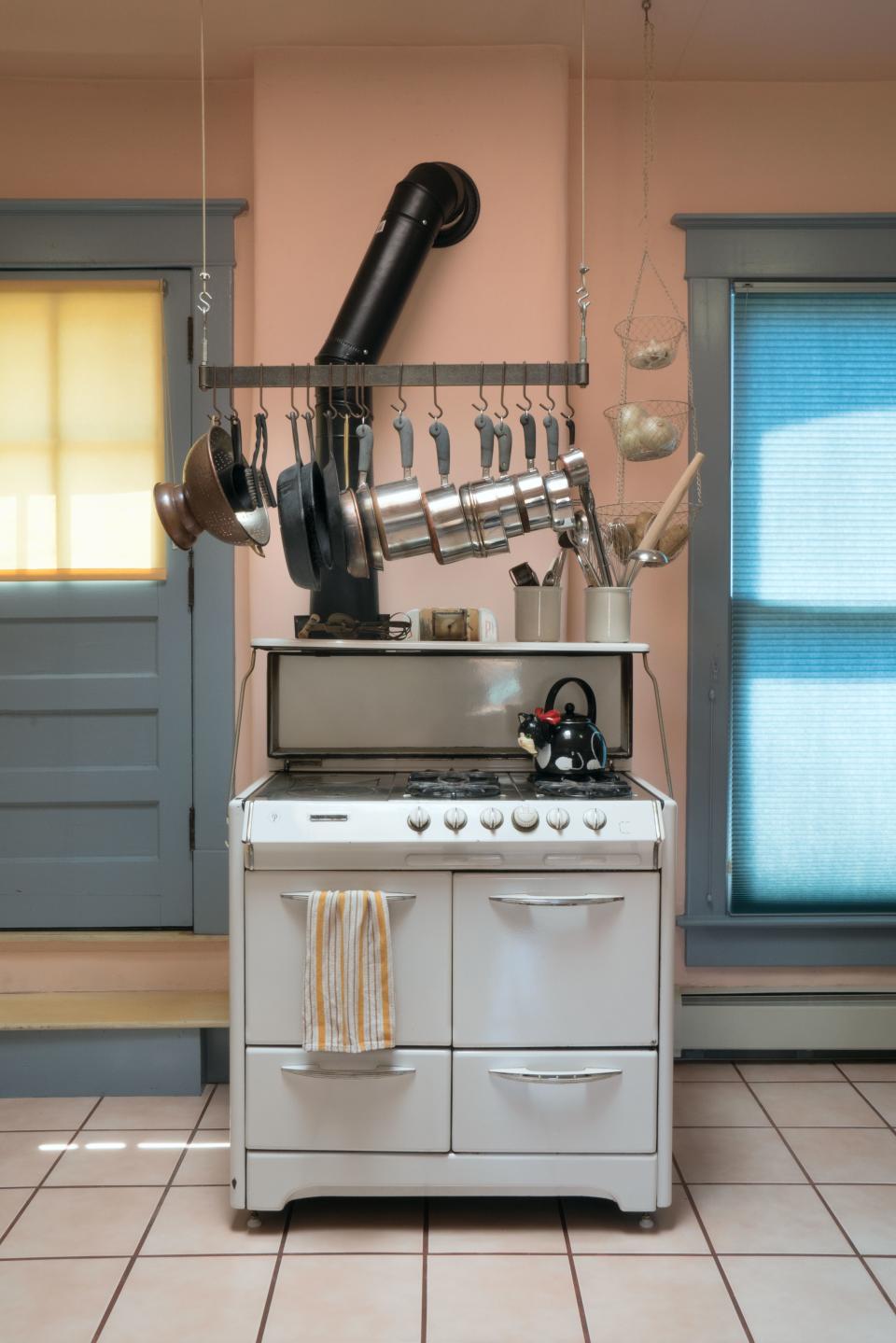 A cast-iron wood-burning/gas combination stove that the couple bought off of an old landlord for $50.