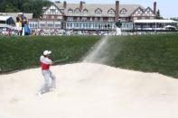 Jul 28, 2016; Springfield, NJ, USA; PGA golfer Jason Day hits out of a sand trap while Rory McIlroy watches on the 18th hole during the first round of the 2016 PGA Championship golf tournament at Baltusrol GC - Lower Course. Brian Spurlock-USA TODAY Sports