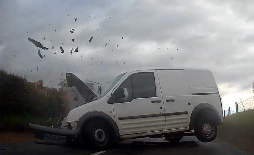 Dashcam footage captured the moment a driver ploughed head-on into a pensioner's car. (SWNS)