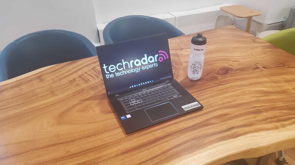 black chromebook on wooden desk