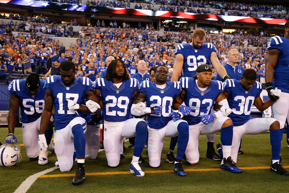 Members of the Indianapolis Colts stand and kneel for the national anthem prior to the start of the game between the Indianapolis Colts and the Cleveland Browns at Lucas Oil Stadium on September 24, 2017 in Indianapolis, Indiana. (Photo by Michael Reaves/Getty Images)