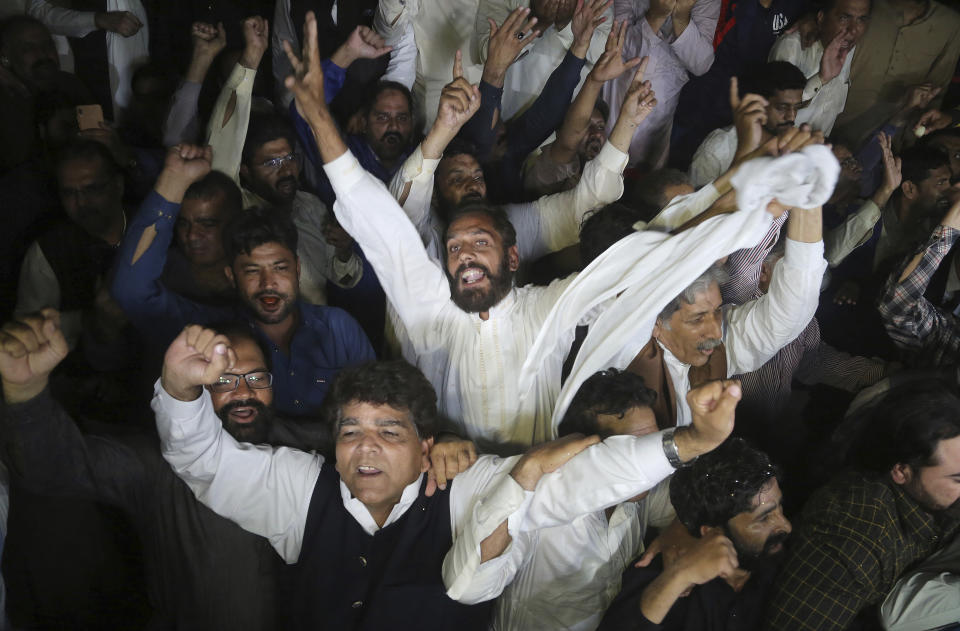 Supporters of Pakistan's former Prime Minister Nawaz Sharif react following court decision outside a hospital where Sharif is admitted, in Lahore, Pakistan, Saturday, Oct. 26, 2019. An Islamabad court in an emergency hearing Saturday temporarily set free Pakistan's ailing former prime minister, Nawaz Sharif, who was in prison on money-laundering and corruption convictions. (AP Photo/K.M. Chaudary)