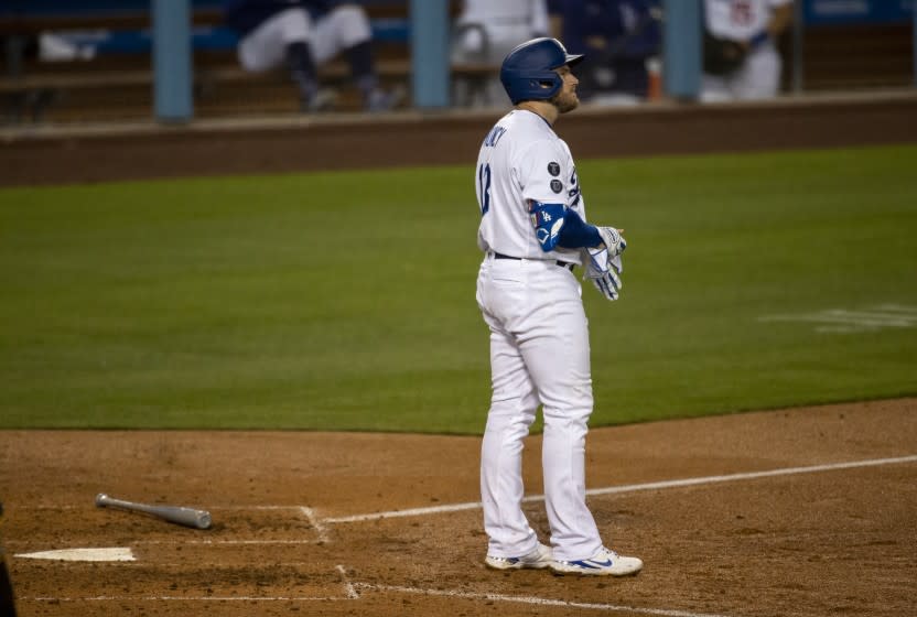 LOS ANGELES, CA - APRIL 22, 2021: Los Angeles Dodgers first baseman Max Muncy (13) stands at home plate after striking out with runners on base against the San Diego Padres in the sixth inning at Dodger Stadium on April 22, 2021 in Los Angeles, California.(Gina Ferazzi / Los Angeles Times)