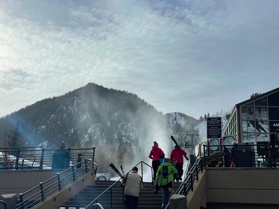 People walking to a gondola in Aspen, Colorado.