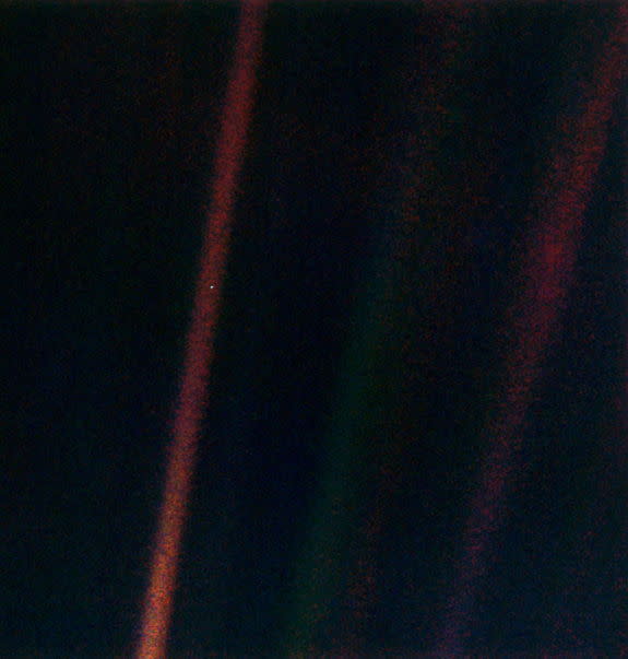 This narrow-angle color image of the Earth s a part of the first ever "portrait" of the solar system taken by Voyager 1. The spacecraft acquired a total of 60 frames for a mosaic of the solar system from a distance of more than 4 billion miles