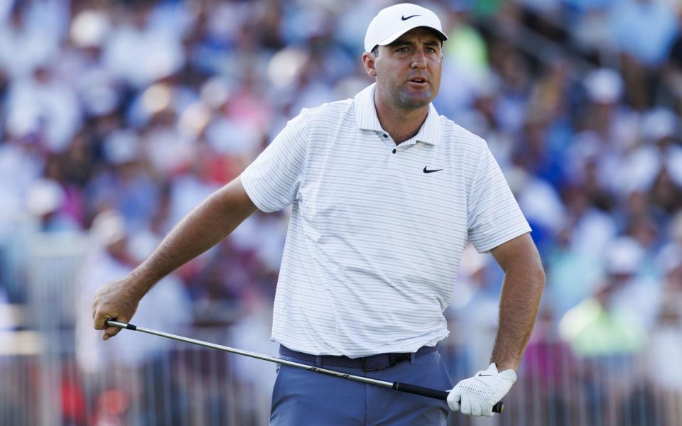 Scottie Scheffler of the US watches his ball from the 13th tee during the second round