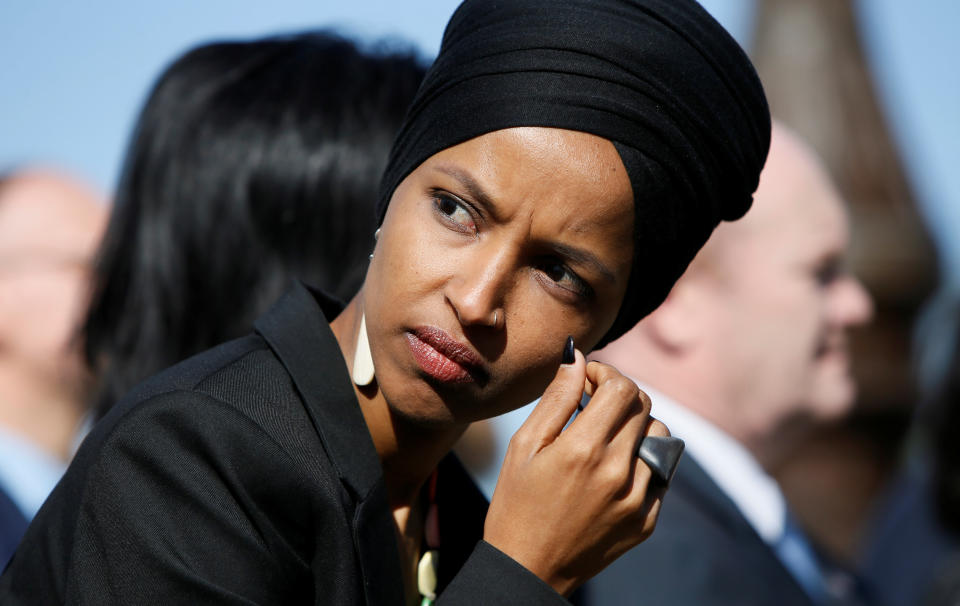 Rep. Ilhan Omar (D-Minn.) participates in an April 10 news conference by members of the U.S. Congress "to announce legislation to repeal President Trump’s existing executive order blocking travel from majority Muslim countries." (Jim Bourg / Reuters)