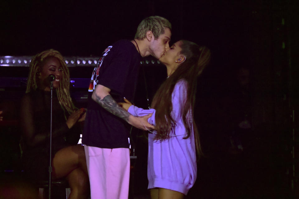 Pete Davidson and Ariana Grande share a kiss onstage during "The Sweetener Sessions" in Los Angeles. (Photo: Kevin Mazur via Getty Images)