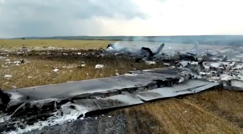 View of debris of a downed Russian military plane, purportedly shot down by Wagner troops, in a field near Bugaevka