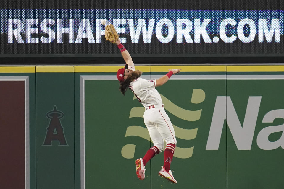 Los Angeles Angels center fielder Brandon Marsh (16) can't reach a sharp line drive hit by Texas Rangers' Nick Solak during the fourth inning of a baseball game Friday, Sep. 3, 2021, in Anaheim, Calif. Solak doubled. (AP Photo/Ashley Landis)