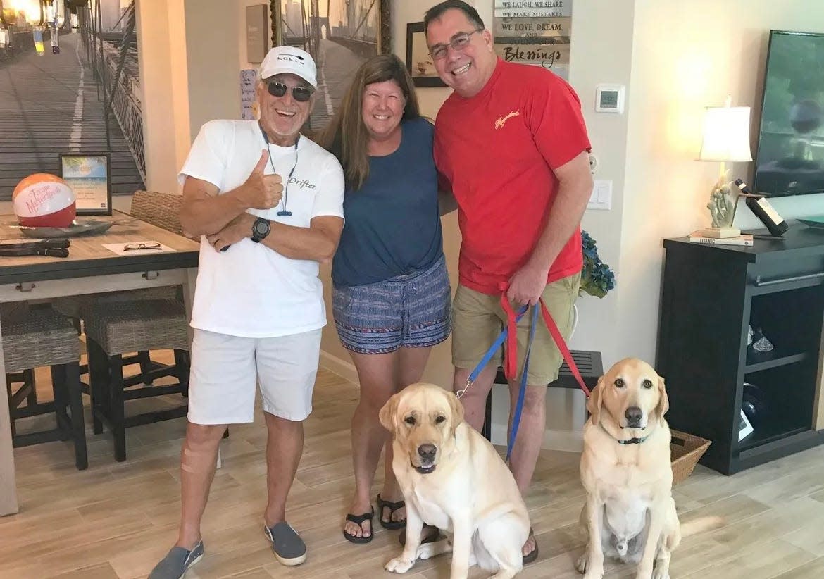 Jimmy Buffett gives a thumbs-up during his surprise visit to the home of Latitude Margaritaville Daytona Beach residents Kelley and Bill Sarantis on July 26, 2018. Also pictured at the couple's dogs Elton and RJ.