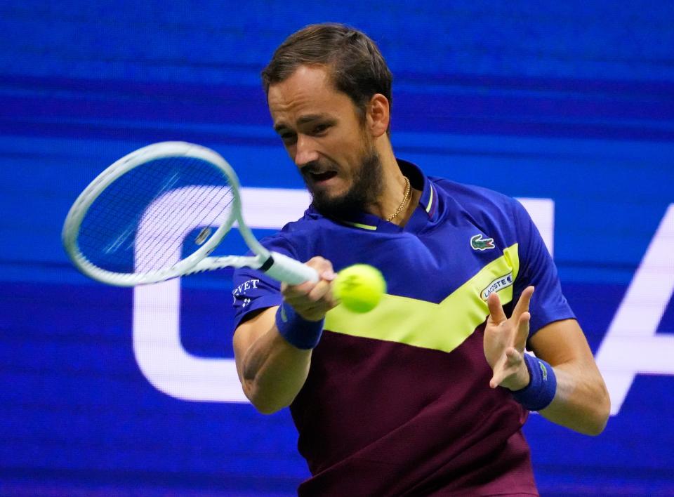 Daniil Medvedev hits a forehand to Carlos Alcaraz during their semifinal match at the 2023 US Open.