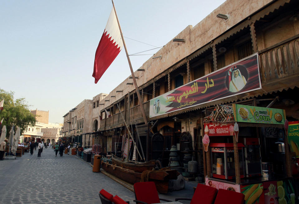 A picture of Qatar’s Emir Sheikh Tamim Bin Hamad Al-Thani is seen over a shop