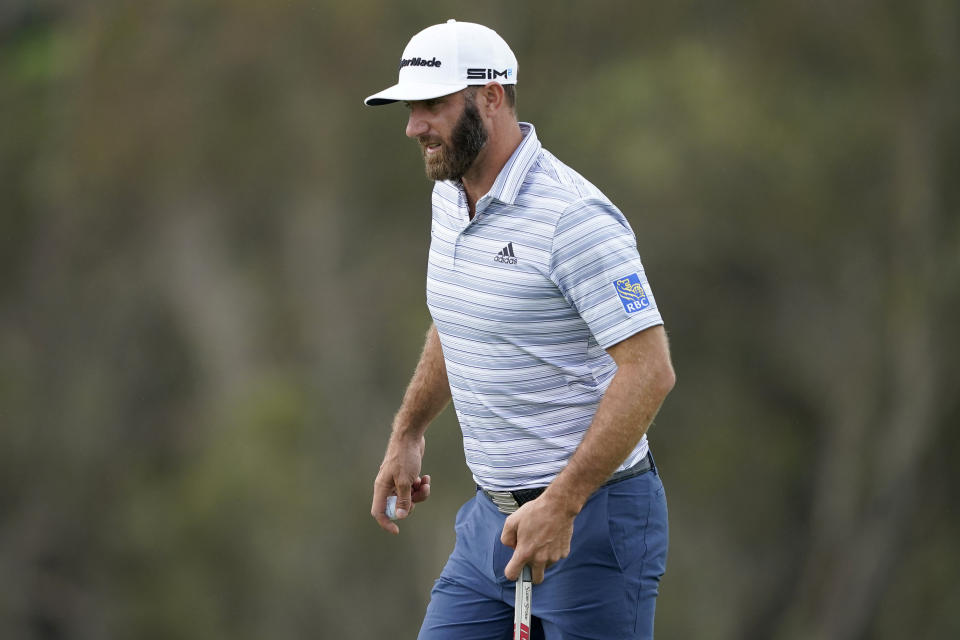 Dustin Johnson walks onto the ninth green during a practice round prior to the Tournament of Champions golf event, Wednesday, Jan. 6, 2021, at Kapalua Plantation Course in Kapalua, Hawaii. (AP Photo/Matt York)