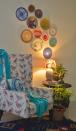 Another view of the living area features a collection of decorative plates.