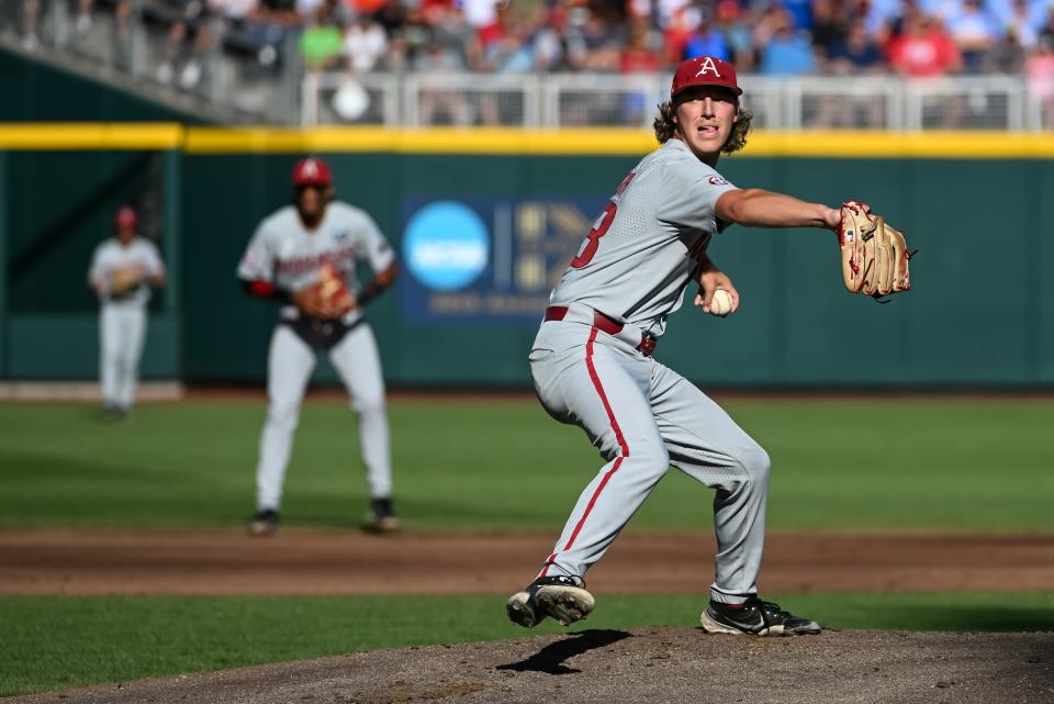 Jun 22, 2022; Omaha, NE, USA; Arkansas Razorbacks starting pitcher Hagen Smith (33) throws against the Ole Miss Rebels in the first inning at Charles Schwab Field. Mandatory Credit: Steven Branscombe-USA TODAY Sports