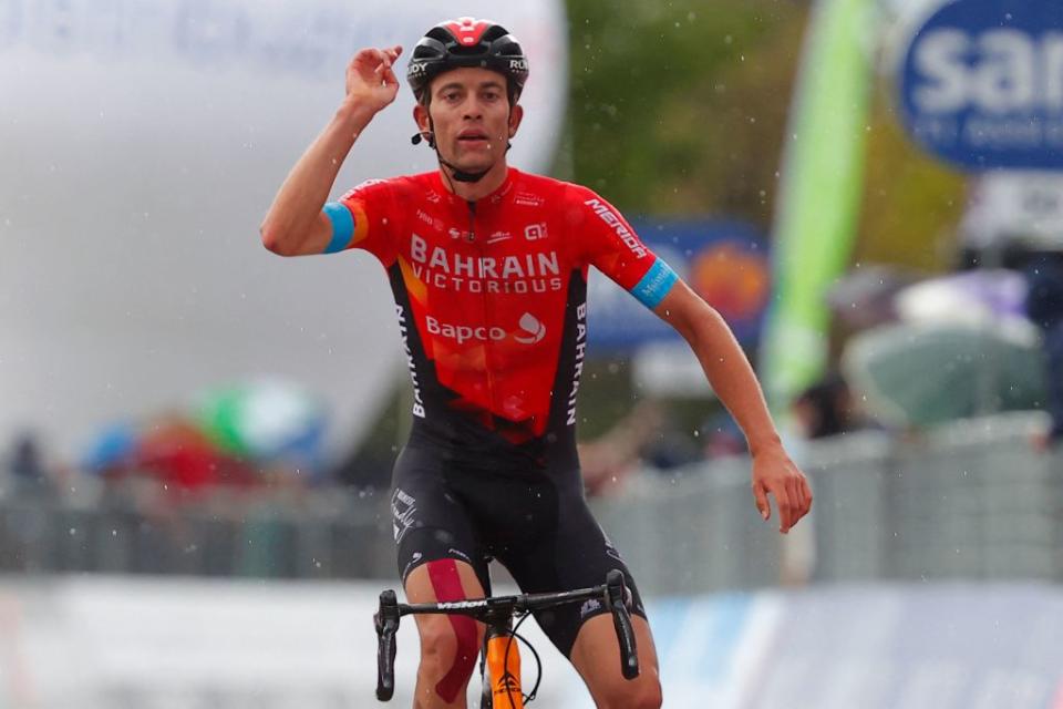 TOPSHOT  Team Bahrain rider Switzerlands Gino Mader celebrates as he crosses the finish line to win during the sixth stage of the Giro dItalia 2021 cycling race 160 km between Grotte di Frasassi and Ascoli Piceno San Giacomo on May 13 2021 Photo by Luca Bettini  AFP Photo by LUCA BETTINIAFP via Getty Images