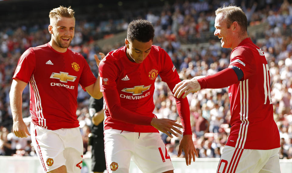 Football Soccer Britain - Leicester City v Manchester United - FA Community Shield - Wembley Stadium - 7/8/16 Manchester United's Jesse Lingard celebrates with Wayne Rooney and Luke Shaw after scoring their first goal Action Images via Reuters / John Sibley Livepic EDITORIAL USE ONLY. No use with unauthorized audio, video, data, fixture lists, club/league logos or "live" services. Online in-match use limited to 45 images, no video emulation. No use in betting, games or single club/league/player publications. Please contact your account representative for further details.