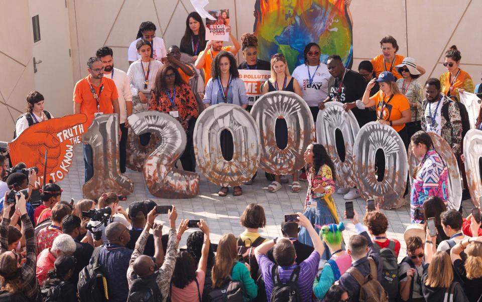 Climate activists protest against fossil fuel emitters and demand further contributions to Cop28's Loss and Damage Fund