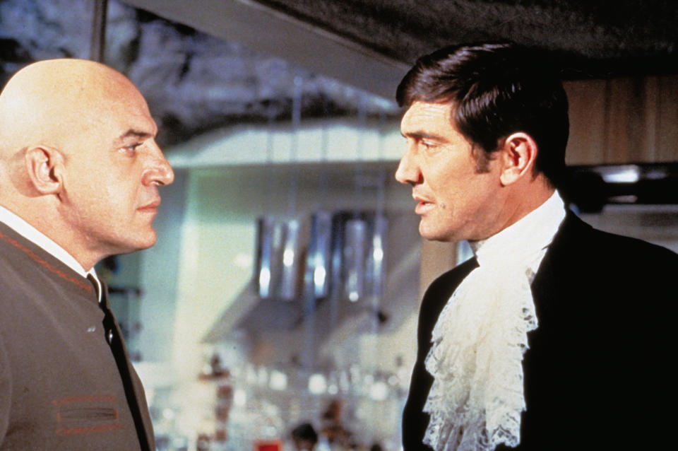 Australian actor George Lazenby and American Telly Savalas on the set of On Her Majesty Secret Service, directed by British Peter R. Hunt. (Photo by Sunset Boulevard/Corbis via Getty Images)