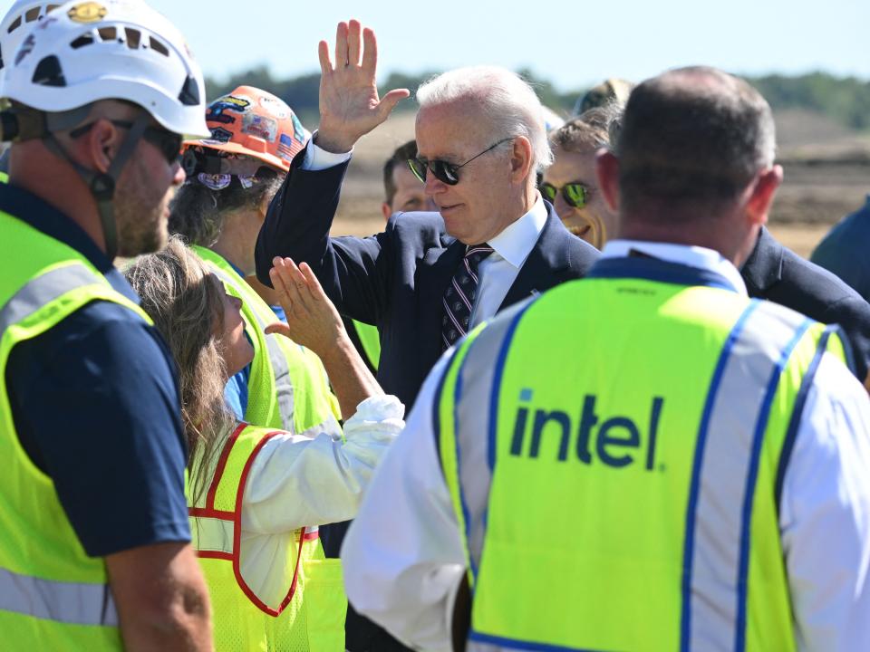 President Biden high-fives an Intel worker at the site of the new semiconductor plant in Ohio