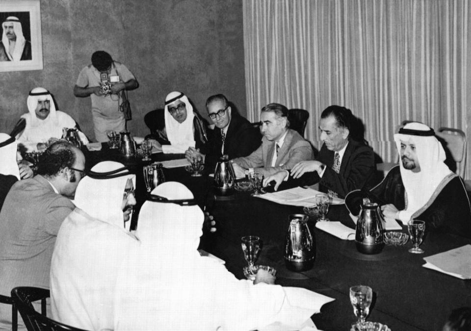 FILE - A subcommittee of six Organization of Petroleum Exporting Countries (OPEC) meets to study the prices of oil in Kuwait on Nov. 3, 1973. The meeting comprised Oil Ministers from Kuwait, Saudi Arabia, Iraq, Iran, Abu Dhabi and Qatar. (AP Photo, File)