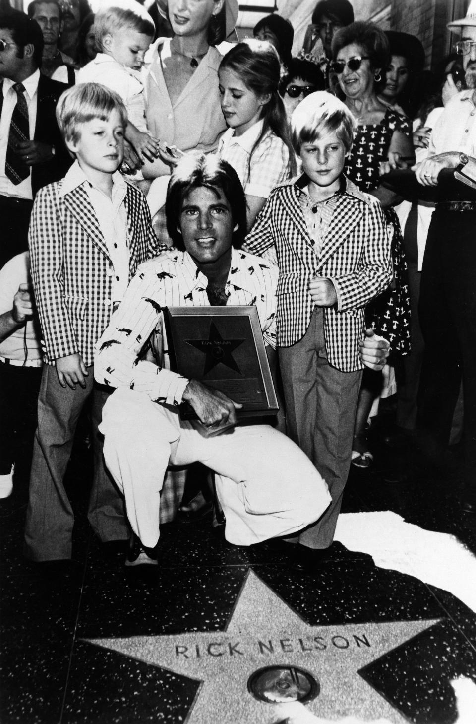 Ricky Nelson poses for a portrait with his family while getting his star on the Hollywood Walk of Fame on Sept. 17, 1975. (Clockwise from Left: Matthew Nelson, Sam Nelson, Kristin Nelson, Tracy Nelson, Gunnar Nelson, Ricky Nelson.) (Photo: Michael Ochs Archives/Getty Images)