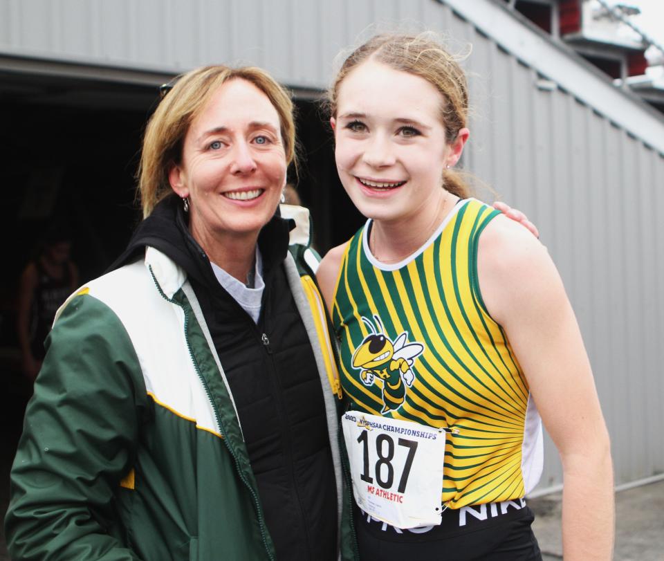 Hastings coach Molly Guilfoyle with Caitlin Thomas, who took second Nov. 11, 2023 in the girls Class C state cross-country championship race in Verona, New York