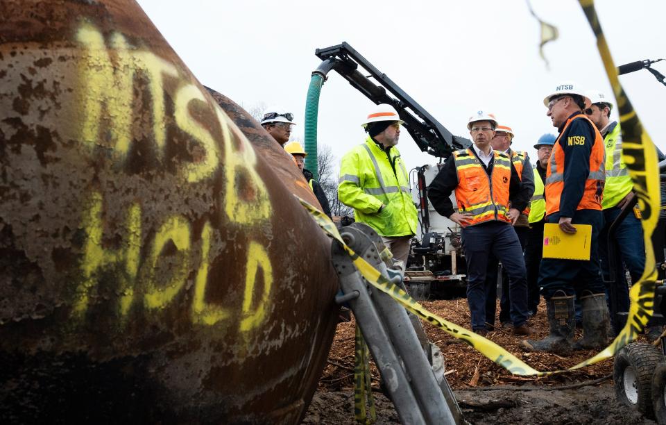 Secretary of Transportation Pete Buttigieg visits with Department of Transportation Investigators at the site of the derailment in East Palestine, Ohio on Feb 23, 2023.