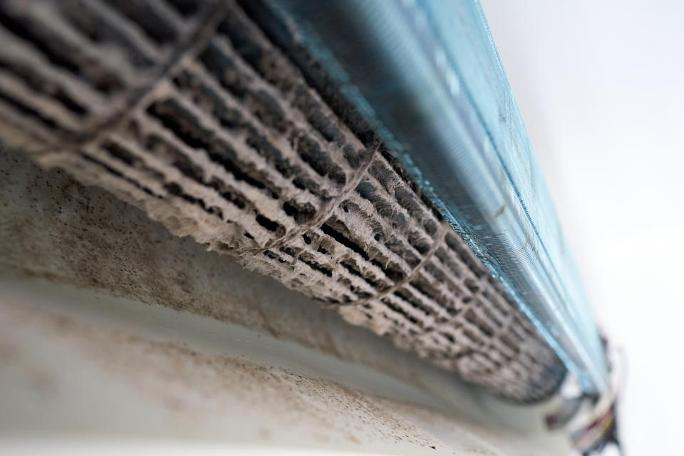 Dust, dirt and mold on the fan, the radiator and the inside of an air conditioner.