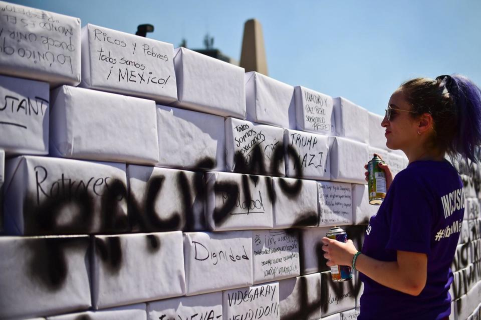 'Racismo': Demonstrators carried signs calling for unity and an end to racism (AFP/Getty Images)